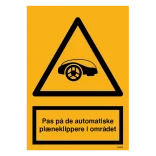 Pas på de automatiske plæneklippere i området advarselsskilt